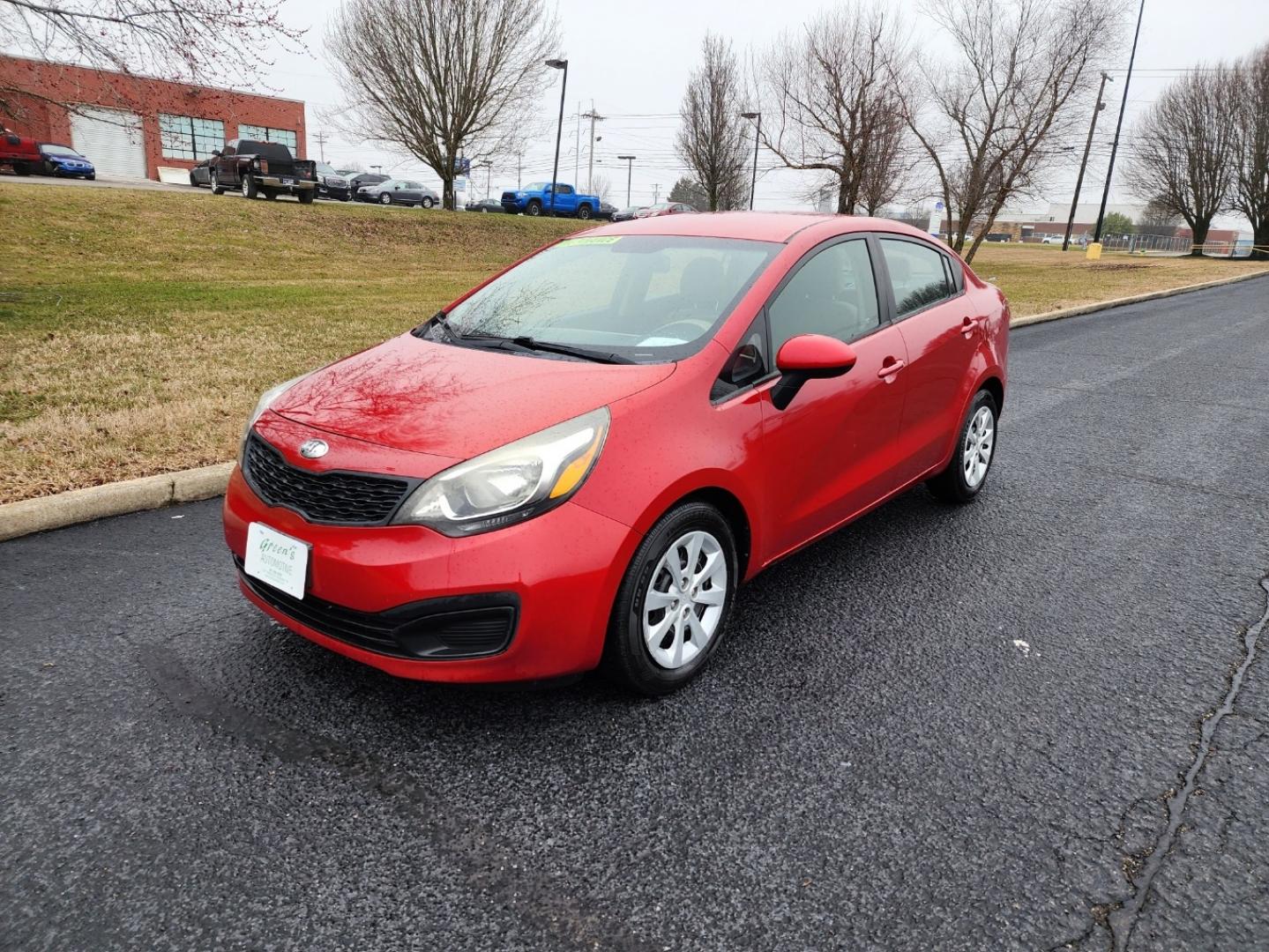 2015 RED /Gray Kia Rio LX (KNADM4A33F6) with an 1.6L L4 DOHC 16V engine, located at 1221 Madison St., Shelbyville, TN, 37160, (931) 680-9439, 0.000000, 0.000000 - Photo#0