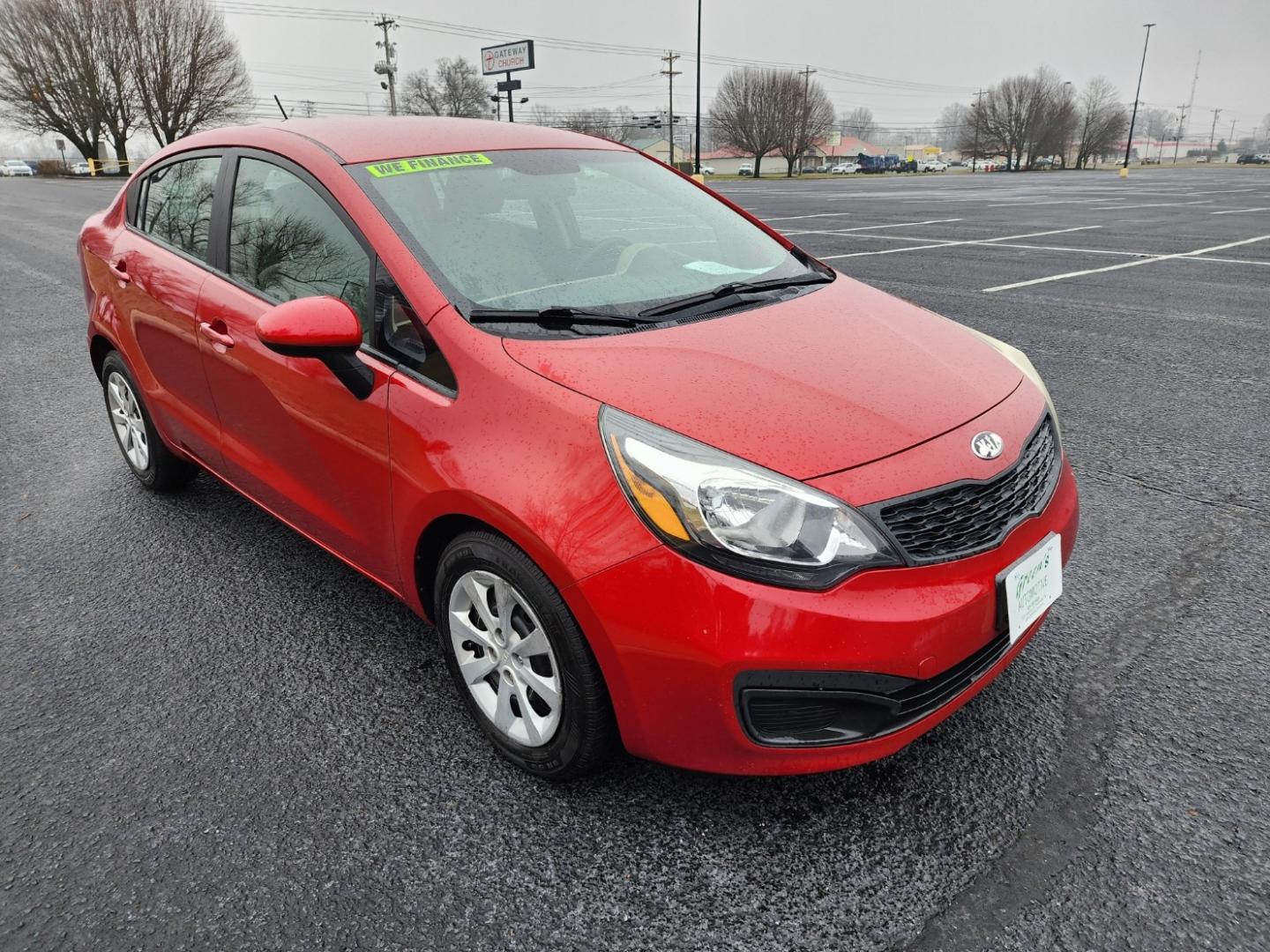 2015 RED /Gray Kia Rio LX (KNADM4A33F6) with an 1.6L L4 DOHC 16V engine, located at 1221 Madison St., Shelbyville, TN, 37160, (931) 680-9439, 0.000000, 0.000000 - Photo#1