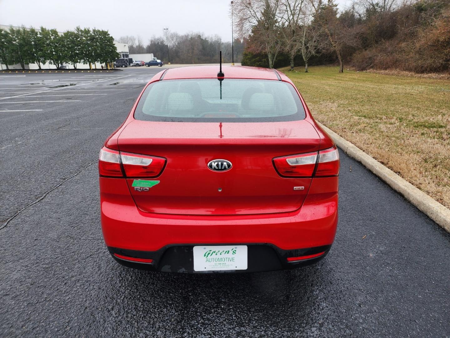 2015 RED /Gray Kia Rio LX (KNADM4A33F6) with an 1.6L L4 DOHC 16V engine, located at 1221 Madison St., Shelbyville, TN, 37160, (931) 680-9439, 0.000000, 0.000000 - Photo#2