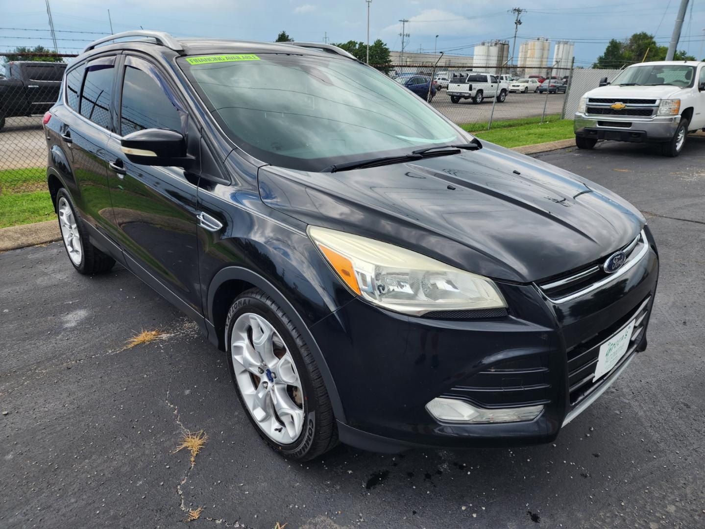 2016 Black /Black Ford Escape Titanium FWD (1FMCU0JX3GU) with an 1.6L L4 DOHC 16V engine, 6-Speed Automatic transmission, located at 1221 Madison St., Shelbyville, TN, 37160, (931) 680-9439, 0.000000, 0.000000 - Photo#1