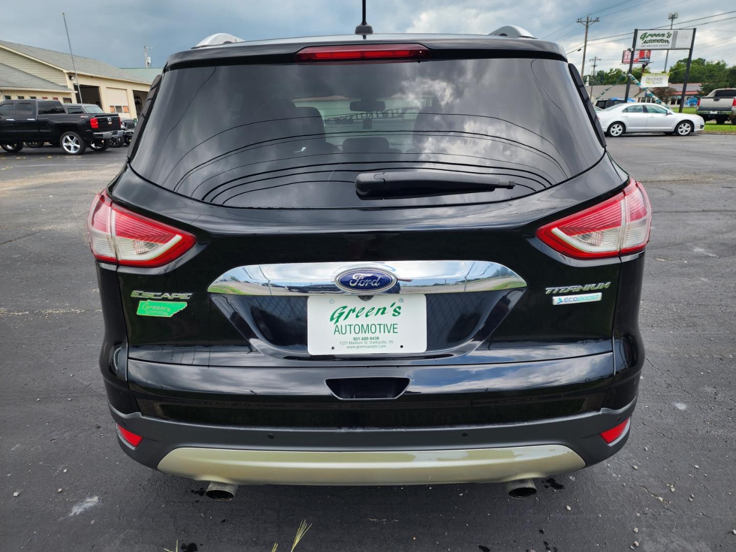 2016 Black /Black Ford Escape Titanium FWD (1FMCU0JX3GU) with an 1.6L L4 DOHC 16V engine, 6-Speed Automatic transmission, located at 1221 Madison St., Shelbyville, TN, 37160, (931) 680-9439, 0.000000, 0.000000 - Photo#2
