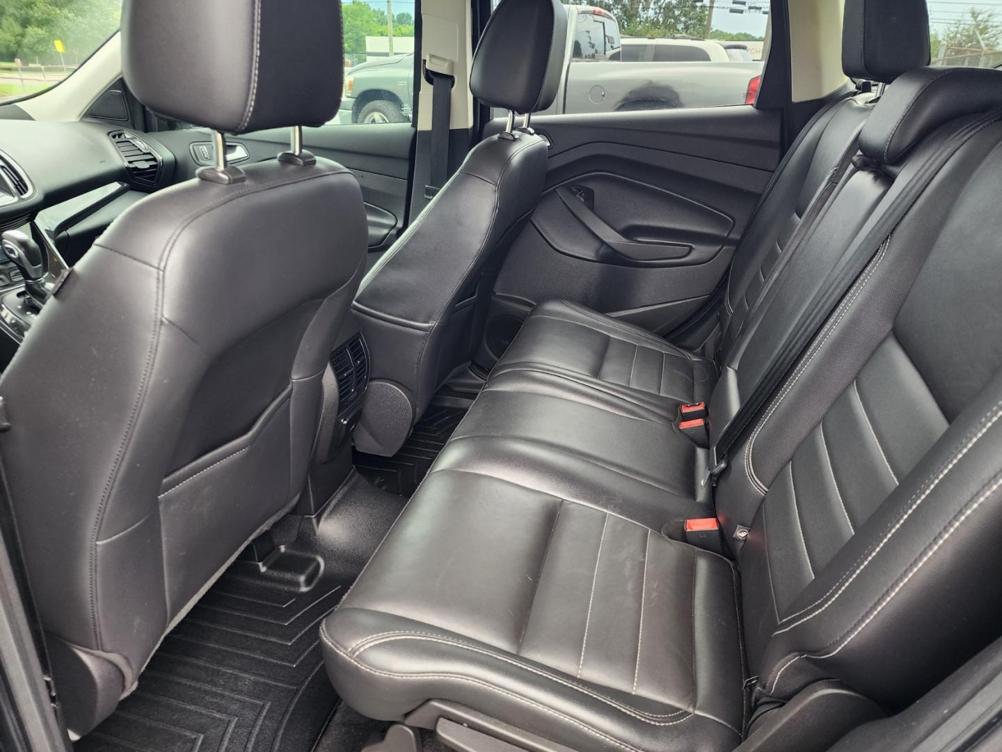 2016 Black /Black Ford Escape Titanium FWD (1FMCU0JX3GU) with an 1.6L L4 DOHC 16V engine, 6-Speed Automatic transmission, located at 1221 Madison St., Shelbyville, TN, 37160, (931) 680-9439, 0.000000, 0.000000 - Photo#4