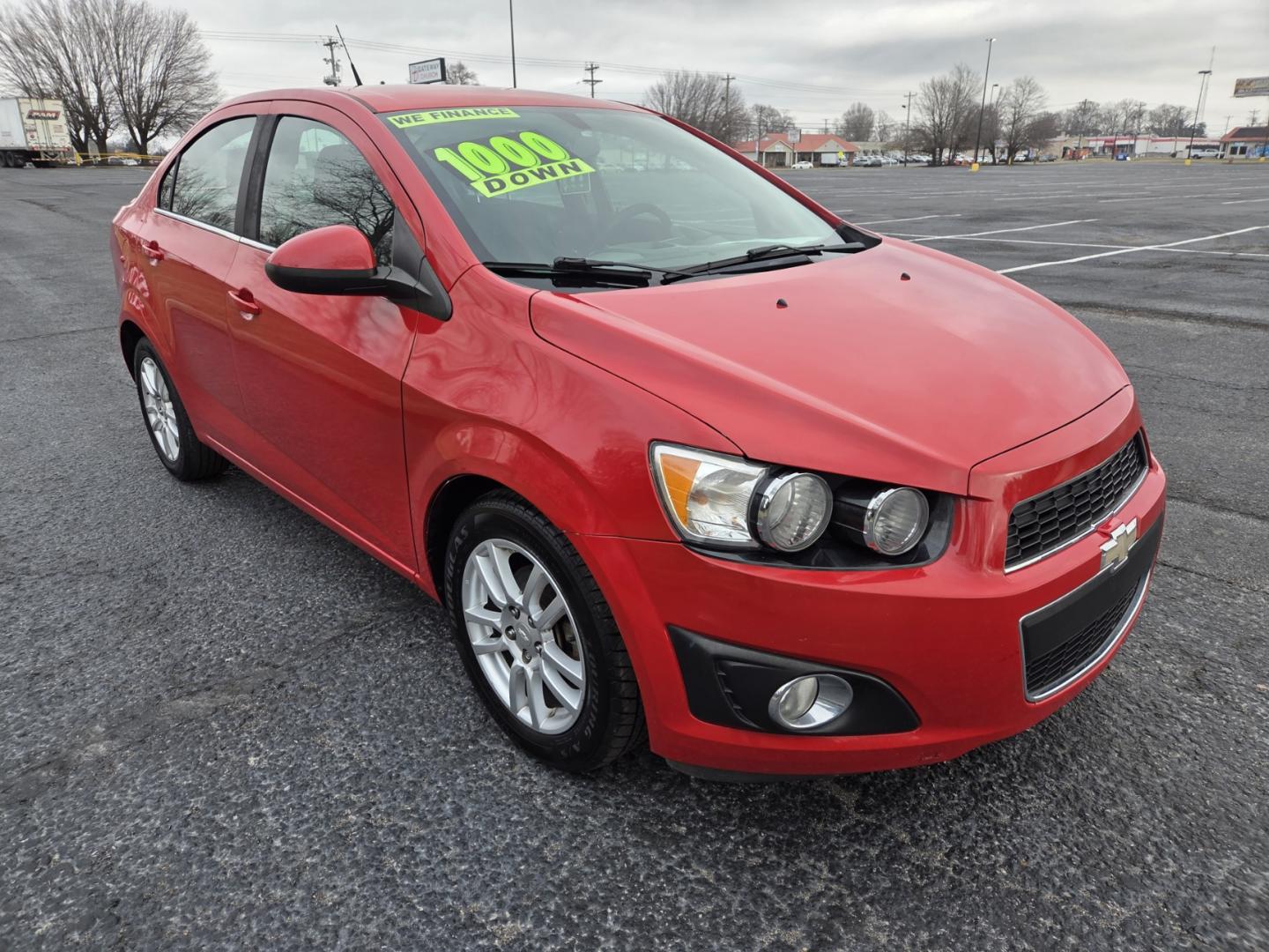 2014 RED /Gray Chevrolet Sonic LT Auto Sedan (1G1JC5SH8E4) with an 1.8L L4 DOHC 24V engine, 6-Speed Automatic transmission, located at 1221 Madison St., Shelbyville, TN, 37160, (931) 680-9439, 0.000000, 0.000000 - Photo#1