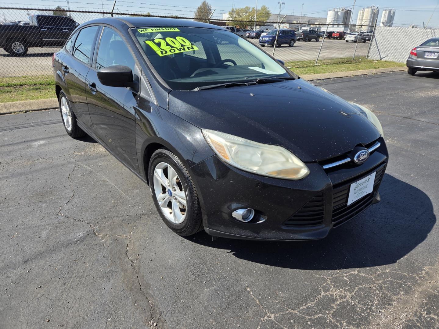 2012 BLACK /Black Ford Focus SE Sedan (1FAHP3F28CL) with an 2.0L L4 DOHC 16V engine, Automatic transmission, located at 1221 Madison St., Shelbyville, TN, 37160, (931) 680-9439, 0.000000, 0.000000 - Photo#1