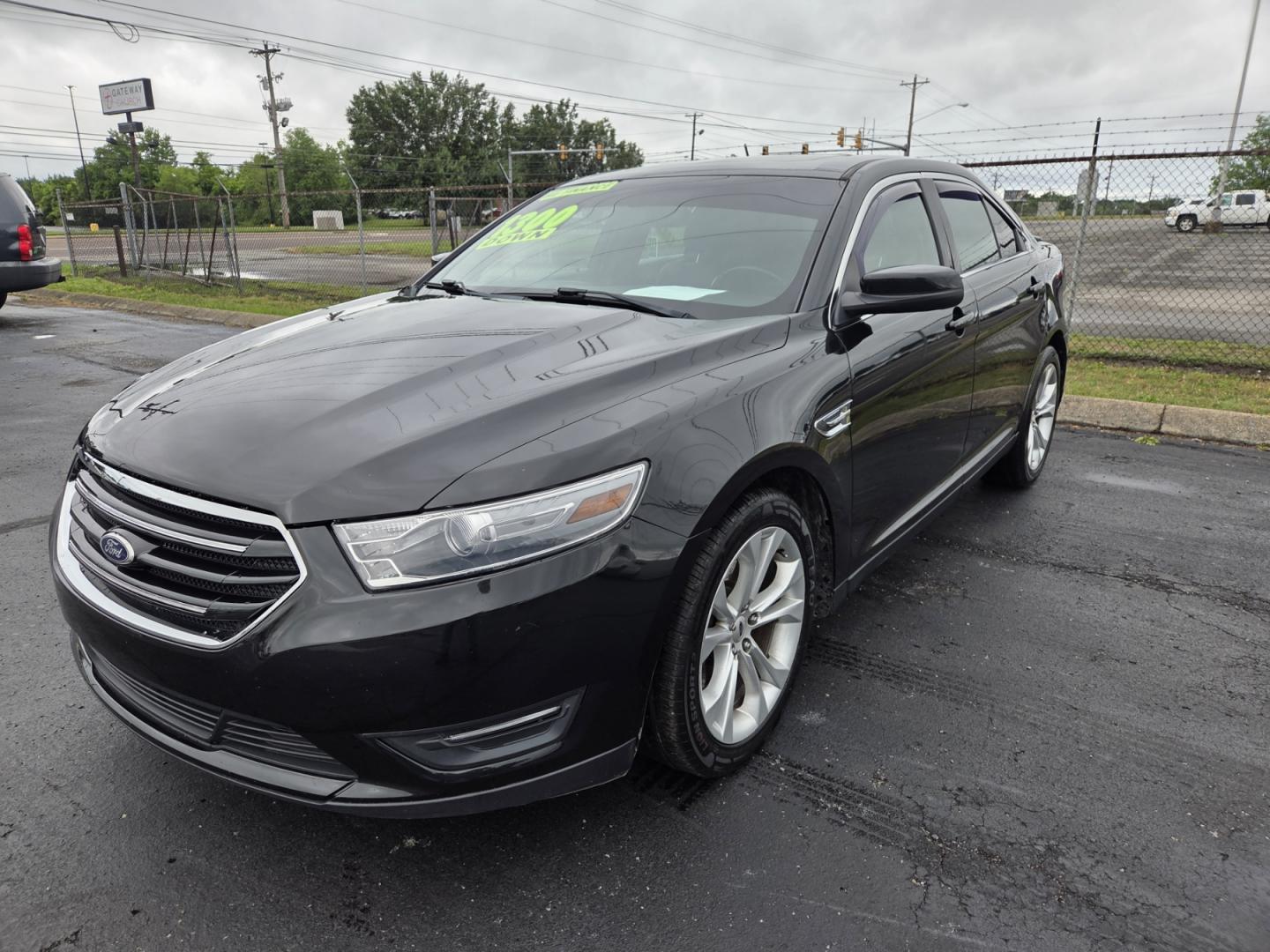 2013 BLACK /Black Ford Taurus SEL FWD (1FAHP2E80DG) with an 3.5L V6 DOHC 24V engine, 6-Speed Automatic transmission, located at 1221 Madison St., Shelbyville, TN, 37160, (931) 680-9439, 0.000000, 0.000000 - Photo#0